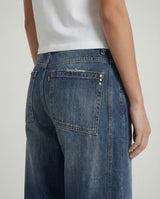Jeans wide leg con banda laterale decorata
